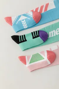 Detailed view of anime themed long tube socks with colorful geometric patterns and knit design.