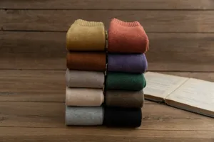 Detailed shot of thick thermal winter fleece socks in assorted vintage solid colors.