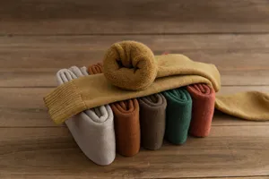 Close-up of thick thermal terry socks, cozy winter knee-high socks in vintage solid colors.