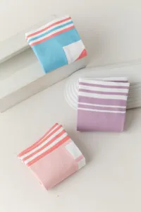 Over-the-knee knit socks for women, trendy striped design, comfortable long socks detail.