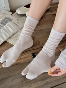 Detailed view of breathable split toe socks for women, sheer thin crew socks with cute design.
