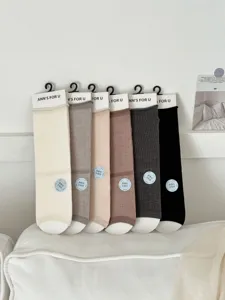 Detailed close-up view of summer thin mulberry silk mid-tube stacking socks in assorted colors.