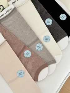 Women's summer thin mulberry silk solid color mid-tube socks comfortable breathable daily wear.