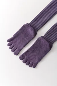 Detailed close-up of purple long tube five-finger yoga socks with ribbed knit texture.