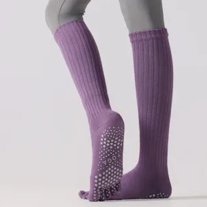 Purple knee-high five-finger yoga socks with non-slip grip dots for women pilates sports.