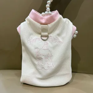 Cute waffle pet vest detail, pink collar and bow, sweet puppy embroidery, soft dog summer clothes.