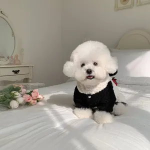 Cute pet winter fleece vest for small dogs and cats, cozy black and white pet apparel detail.