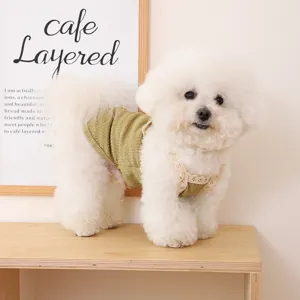 Breathable lace strap pet vest for small dogs and cats, cute summer green pet clothing detail.