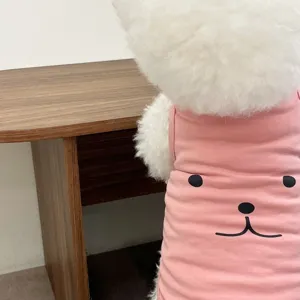 Pink pet vest detail, breathable summer dog clothes with cute cartoon face print, soft fabric.