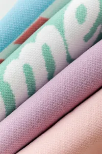 Detailed view of women's knit long socks, showing soft texture and colorful striped patterns.
