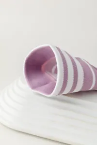 Purple white striped knee high socks detail view, cozy knit long tube fashion hosiery.