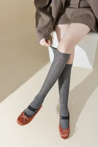 Grey metallic knit knee-high socks for women, stylish ballet core fashion hosiery detail.