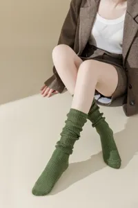 Green glitter knit slouch socks detail shot, soft texture and comfortable fit for daily wear.