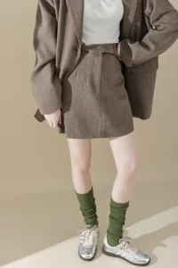 Detail view of metallic knit stacking socks, featuring coarse knit texture for stylish outfit.