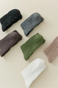 Close-up of glitter knit slouch socks featuring ribbed texture and soft fabric.