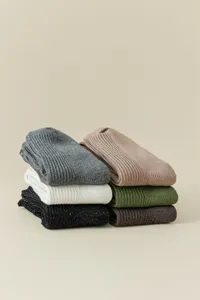 Detailed shot of metallic knit slouchy socks in assorted colors, showing texture and soft fold.