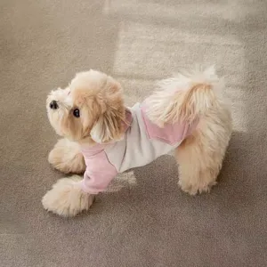 Detail view of a cute color-block pet hoodie with hood, soft and warm for small dogs.
