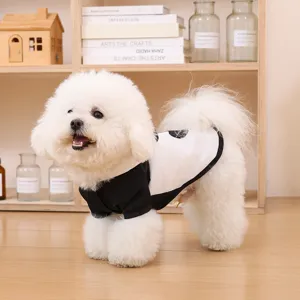 Detail view of black and white small dog raincoat, cute pet apparel for bichon and teddy.