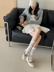 Breathable mesh stirrup leg warmers for women, thin knit summer fashion sock detail view.