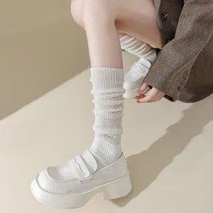 White knit slouch calf socks for women, retro pleated design cozy fashion daily wear.