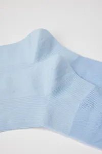 Close-up detail of light blue mesh calf socks highlighting breathable knit texture and ribbing.