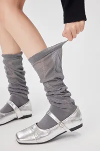 Grey sheer mesh slouch socks detail showing elasticity and breathable lightweight fabric style.