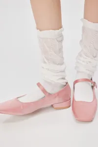 Sweet ballet style white slouch socks paired with pink satin flat shoes detail view.