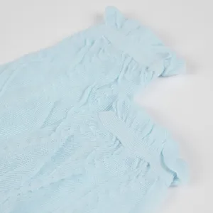 Light blue knitted ruffle leg warmers sweet ballet style slouch socks for women detail view.