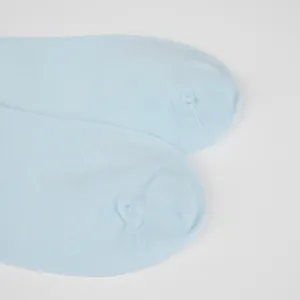Close-up view of light blue women socks toe part, thin breathable knit summer daily wear detail.