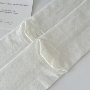 Breathable white split-toe socks detail, soft cotton texture for comfortable daily wear.