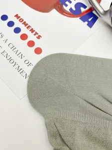 Close-up detail of lightweight breathable knitted footless leg warmers for summer wear.