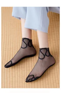 Close-up detail of black sheer mesh lace women socks showcasing breathable short ankle design.
