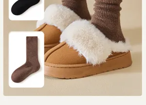 Detailed view of thick fleece-lined winter wool socks paired with cozy fluffy slippers.