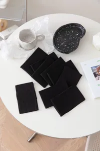 Detailed view of ultra-thin black sheer calf socks, soft breathable fabric for summer daily wear.