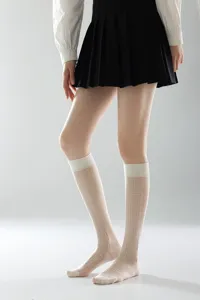 Close-up of sheer knee high socks showing diamond mesh pattern, breathable summer hosiery.