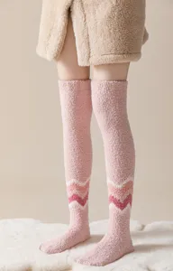 Cozy fuzzy over-the-knee coral fleece winter socks detail, soft pink warm thermal hosiery.