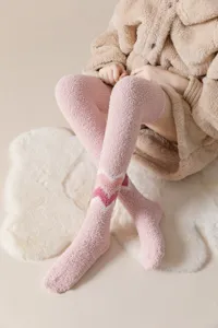 Thickened coral fleece over-the-knee long socks for women, cozy winter warm fuzzy floor socks detail.