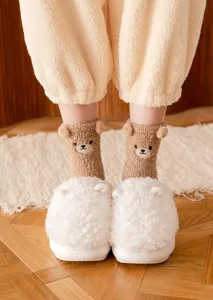 Cute winter plush thick coral fleece mid-tube socks with 3D bear ears for cozy home floor wear.