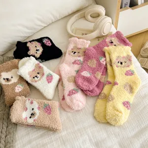 Cozy coral fleece socks with cute bear and strawberry prints, warm winter sleep socks for home wear.