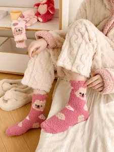 Cozy fuzzy coral fleece socks with cute bear and strawberry design for warm winter home wear.