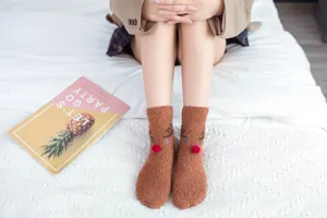Cozy brown coral fleece Christmas reindeer socks with cute red pom pom nose for women warm sleep.