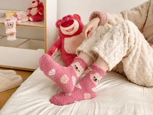 Cozy pink coral fleece socks for women, cute strawberry bear pattern, winter thermal sleep socks.