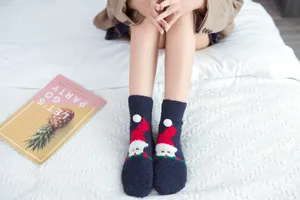 Cozy Christmas coral fleece fuzzy socks for women, warm winter sleep floor socks detail.
