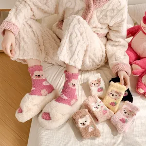 Cozy winter fuzzy coral fleece socks for women, featuring cute cartoon bear detail presentation.