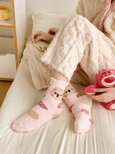 Cozy pink fuzzy plush socks for women, thick coral fleece winter sleep and floor socks.