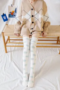 Cozy coral fleece over-the-knee socks with cute polka dots, ideal for home sleep and warm loungewear.