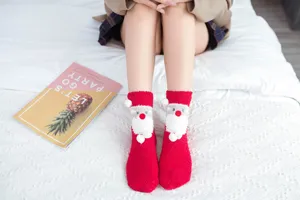 Cozy coral fleece Christmas socks for women with cute 3D Santa plush design for warm indoor wear.