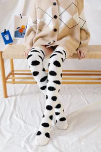 Cozy fuzzy over the knee socks with soft coral fleece and cute black polka dot winter pattern.