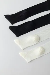 Black and white knee high socks with diamond pattern, lightweight and breathable spring wear.