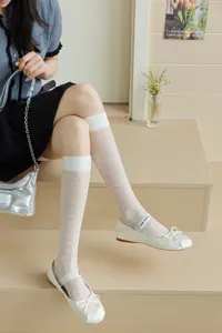 White sheer knee high socks for women, thin transparent summer hosiery with cute heart pattern.
